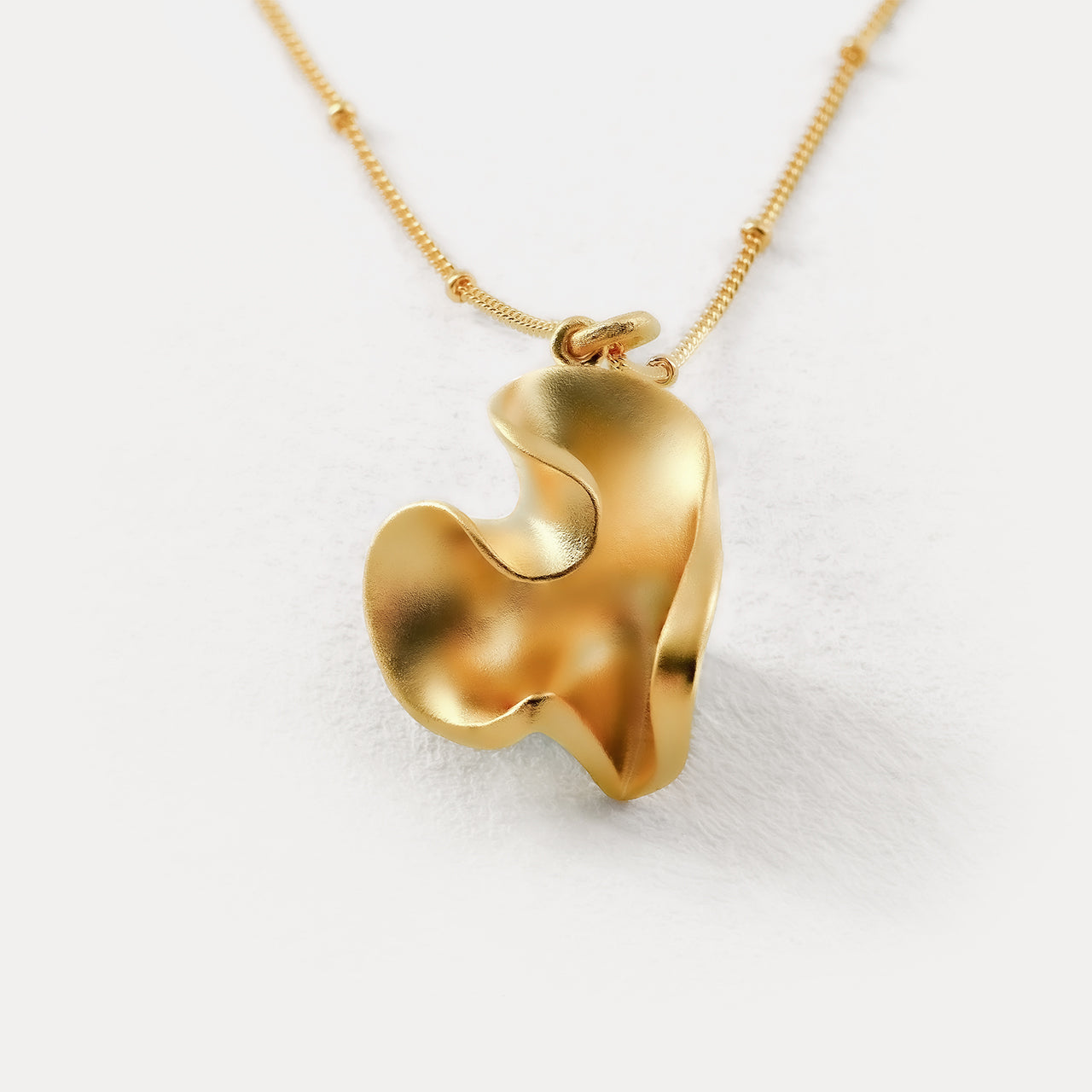 LOVE gold heart-shaped pendant-close up