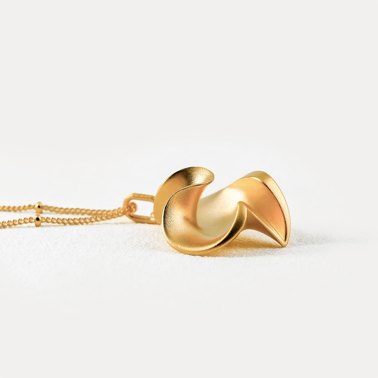 LOVE gold heart-shaped pendant-close up side